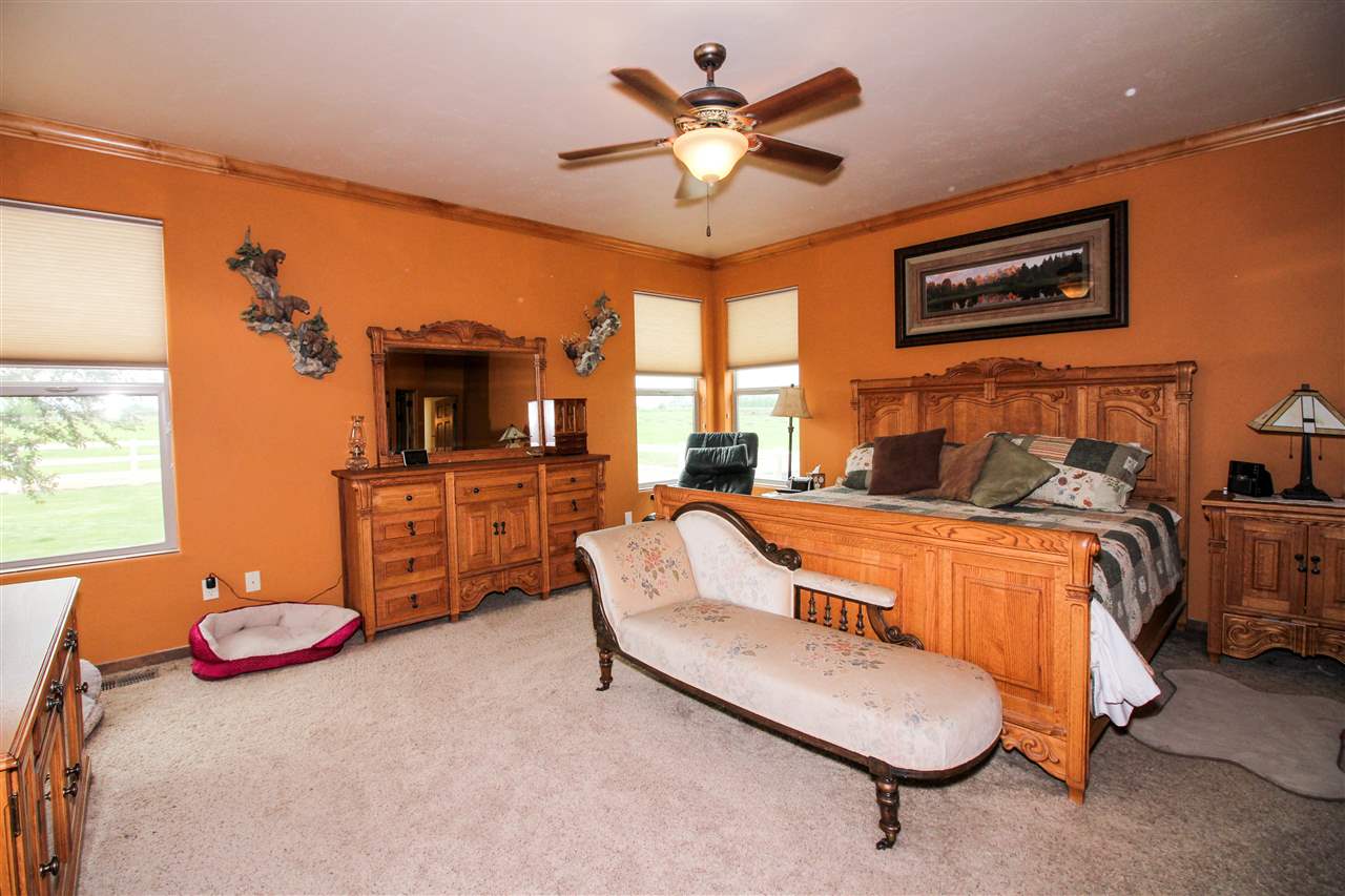 1114 22 Road Grand Junction, CO 81505 - Photo 10 of 26 a bedroom with furniture and a large window