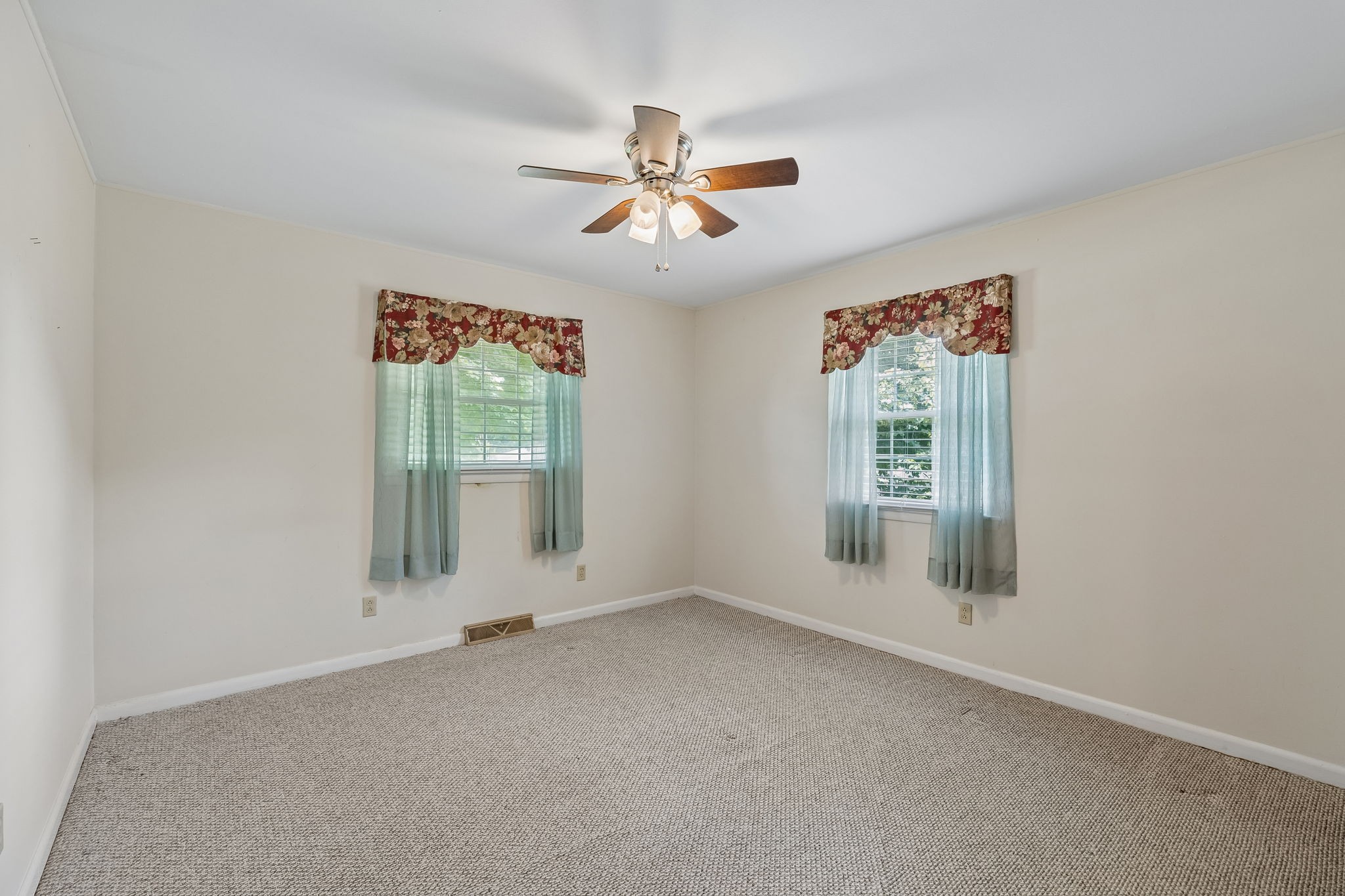708 Hickory Street Centerville, TN 37033 - Photo 28 of 57 an empty room with windows and fan