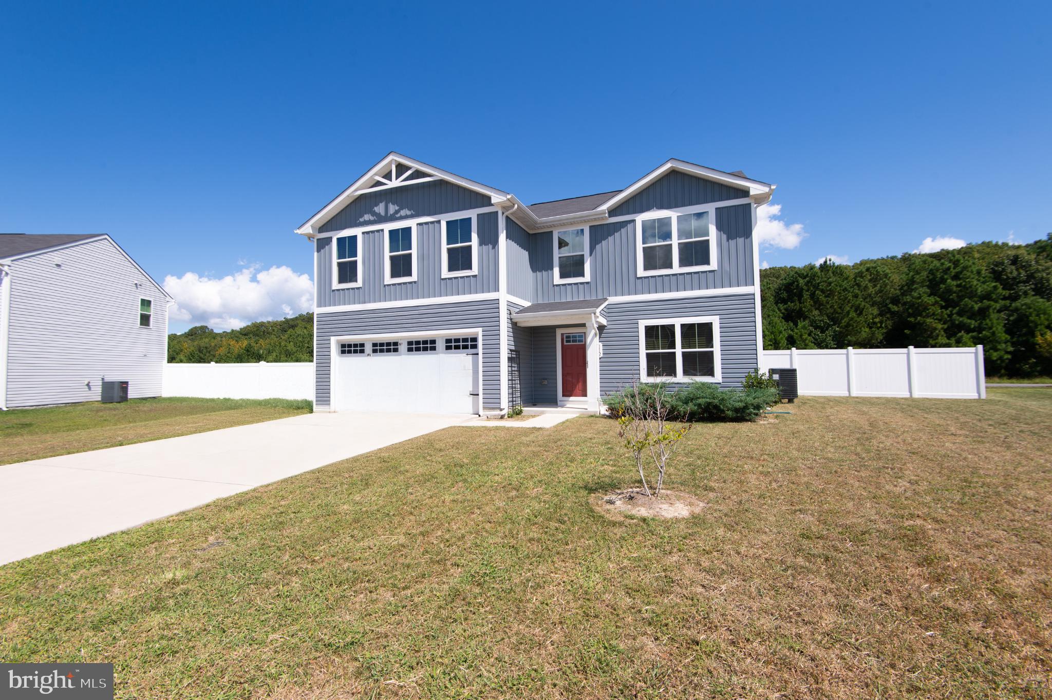Charming two-story home with spacious yard.