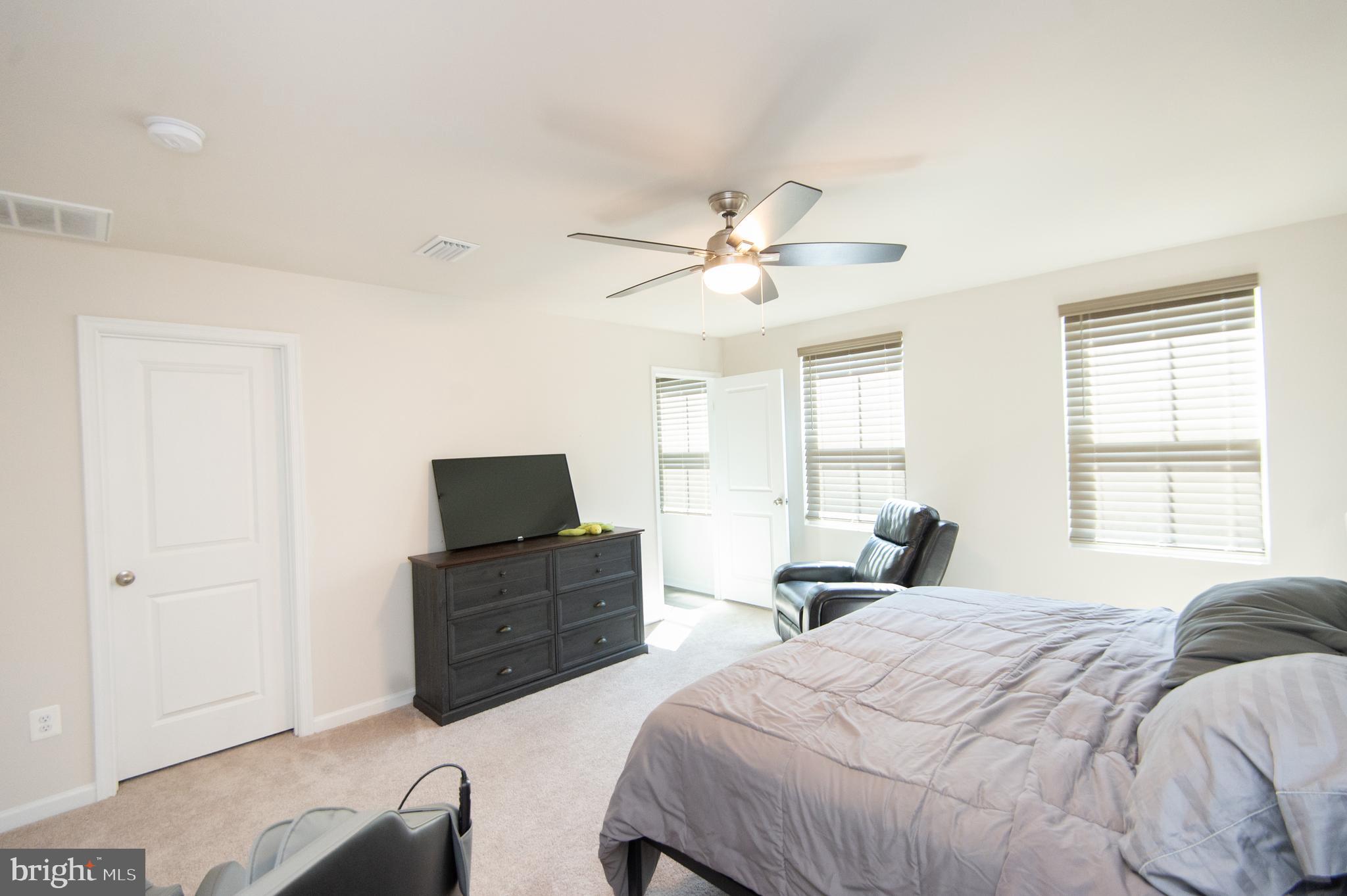 112 Mariners Way Cambridge, MD 21613 - Photo 13 of 29 a bedroom with a bed and a tv