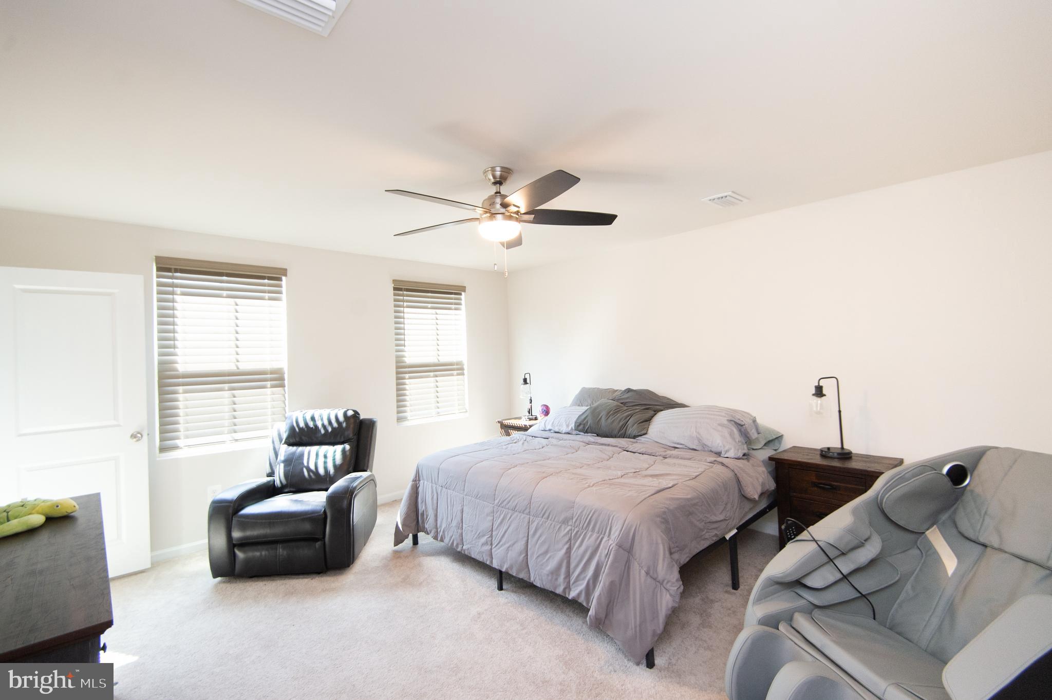 112 Mariners Way Cambridge, MD 21613 - Photo 14 of 29 a bedroom with bed and a couch