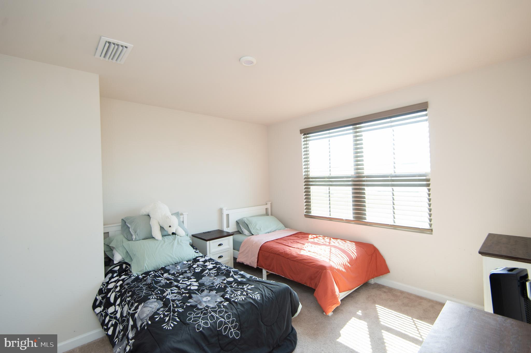 112 Mariners Way Cambridge, MD 21613 - Photo 17 of 29 a bedroom with a bed and wooden floor