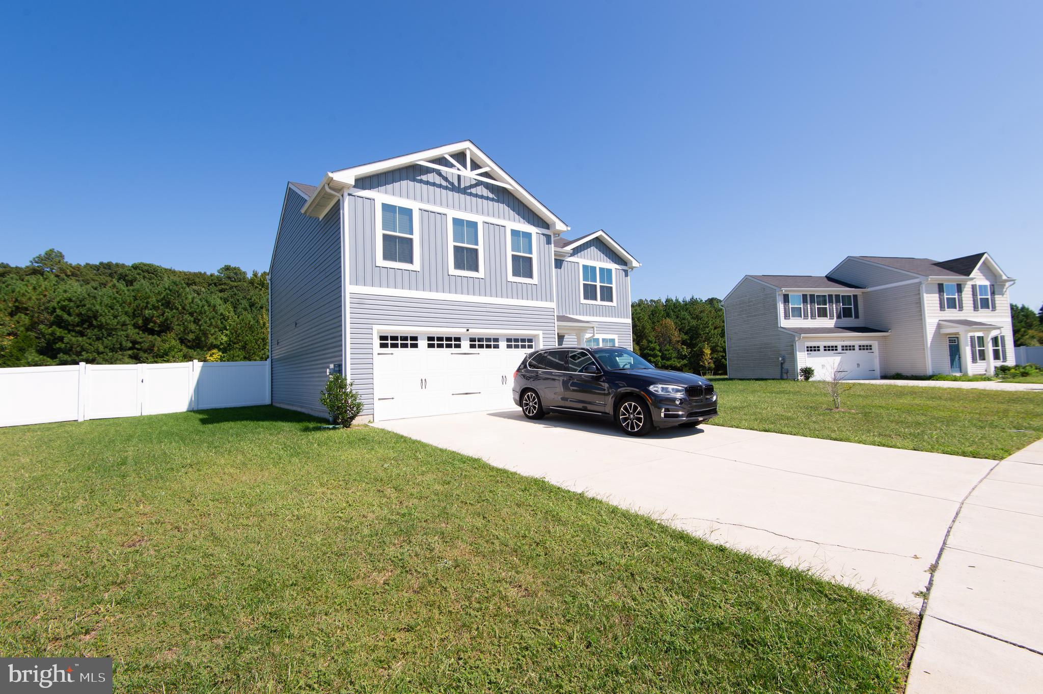 112 Mariners Way Cambridge, MD 21613 - Photo 2 of 29 a house view with a garden space