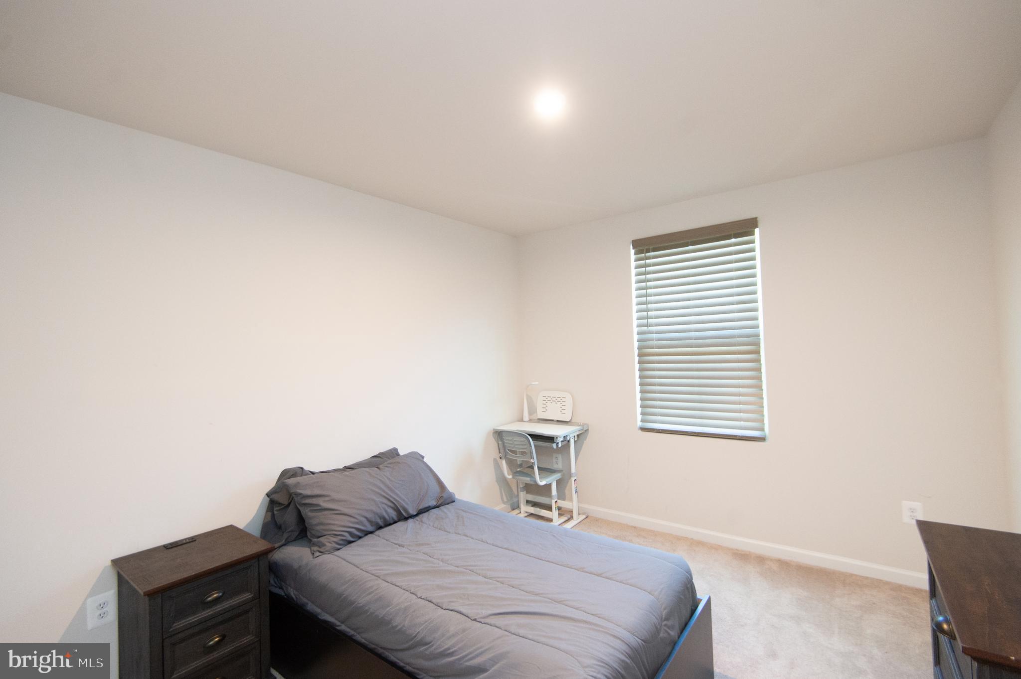 112 Mariners Way Cambridge, MD 21613 - Photo 21 of 29 a bedroom with a bed and a window