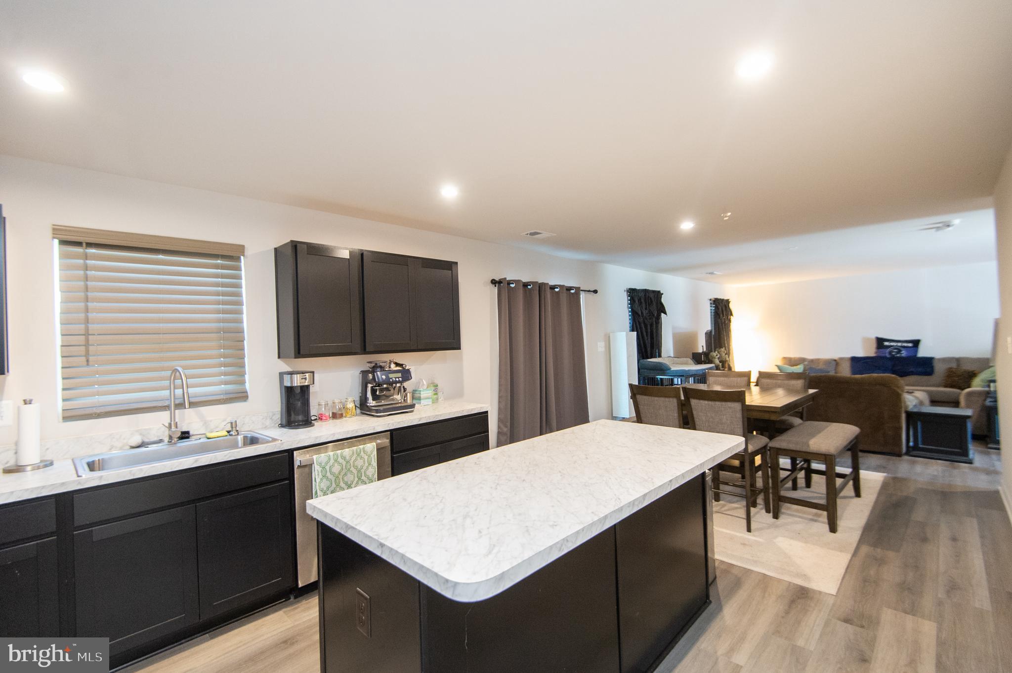 112 Mariners Way Cambridge, MD 21613 - Photo 8 of 29 a large kitchen with a table and chairs