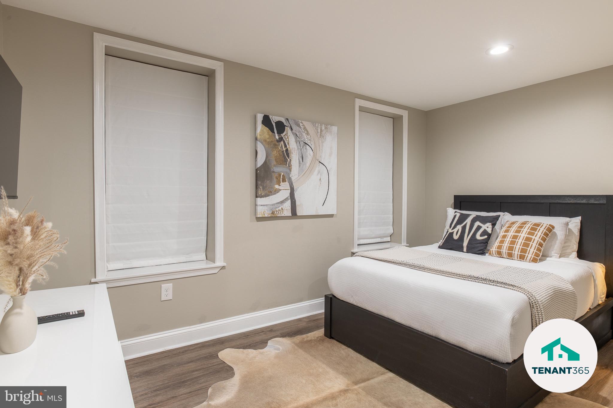 3221 Noble Street, Unit 4 Baltimore, MD 21224 - Photo 15 of 18 Modern bedroom with serene decor.