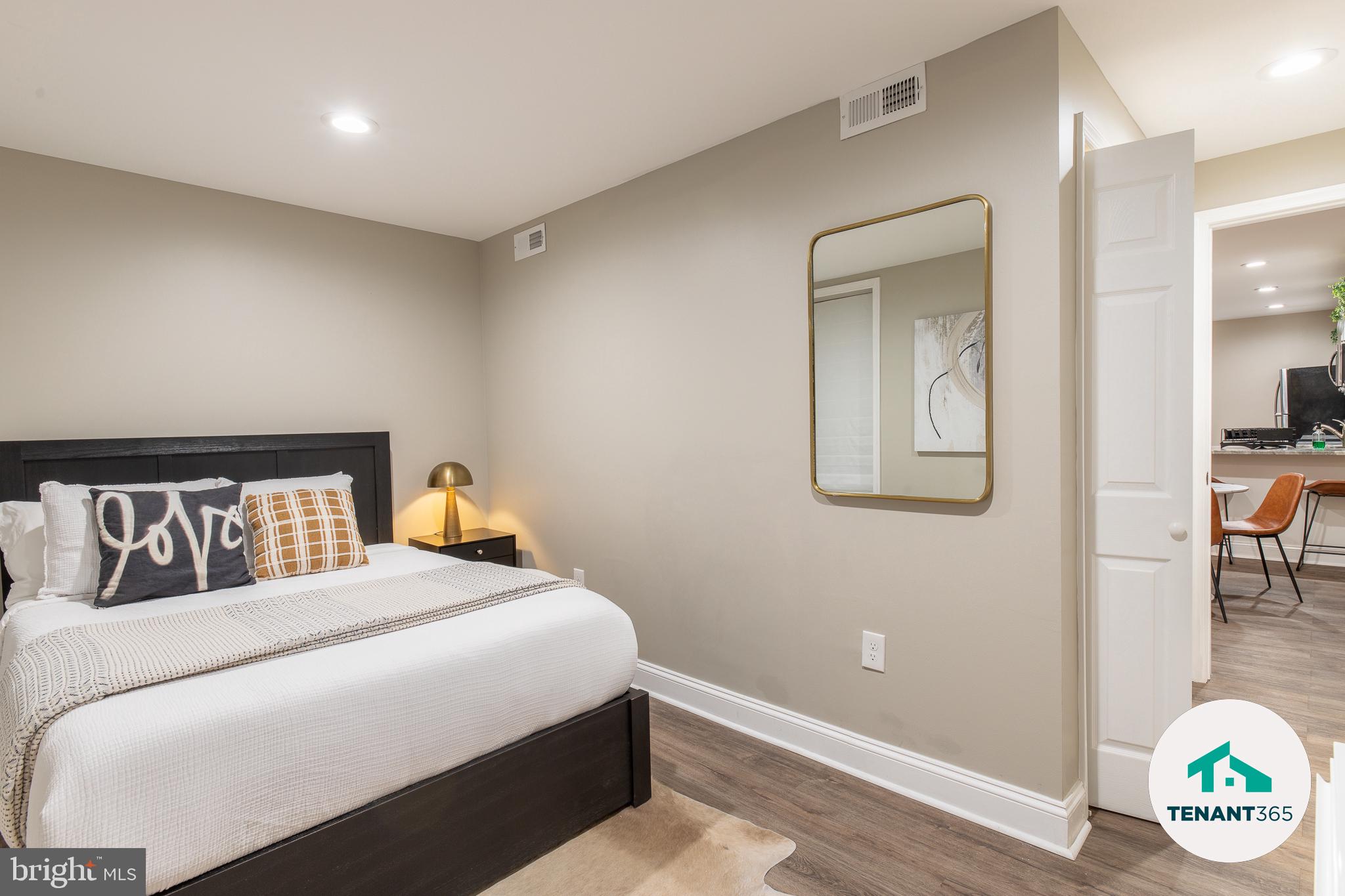 3221 Noble Street, Unit 4 Baltimore, MD 21224 - Photo 17 of 18 Cozy bedroom with modern elegance.