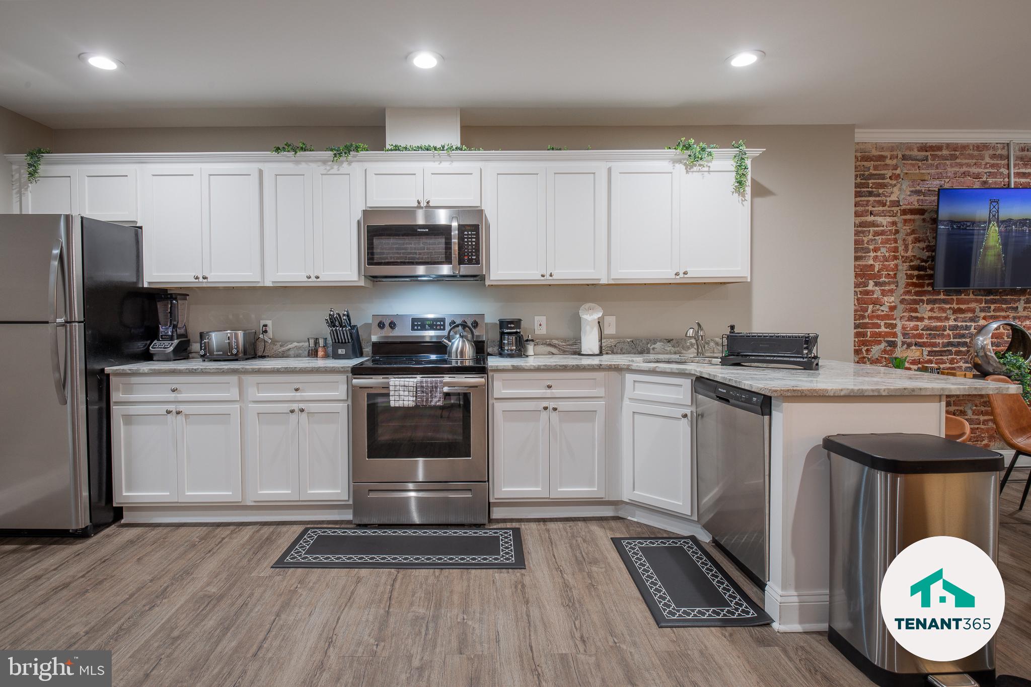 3221 Noble Street, Unit 4 Baltimore, MD 21224 - Photo 2 of 18 Modern kitchen with stylish finishes.