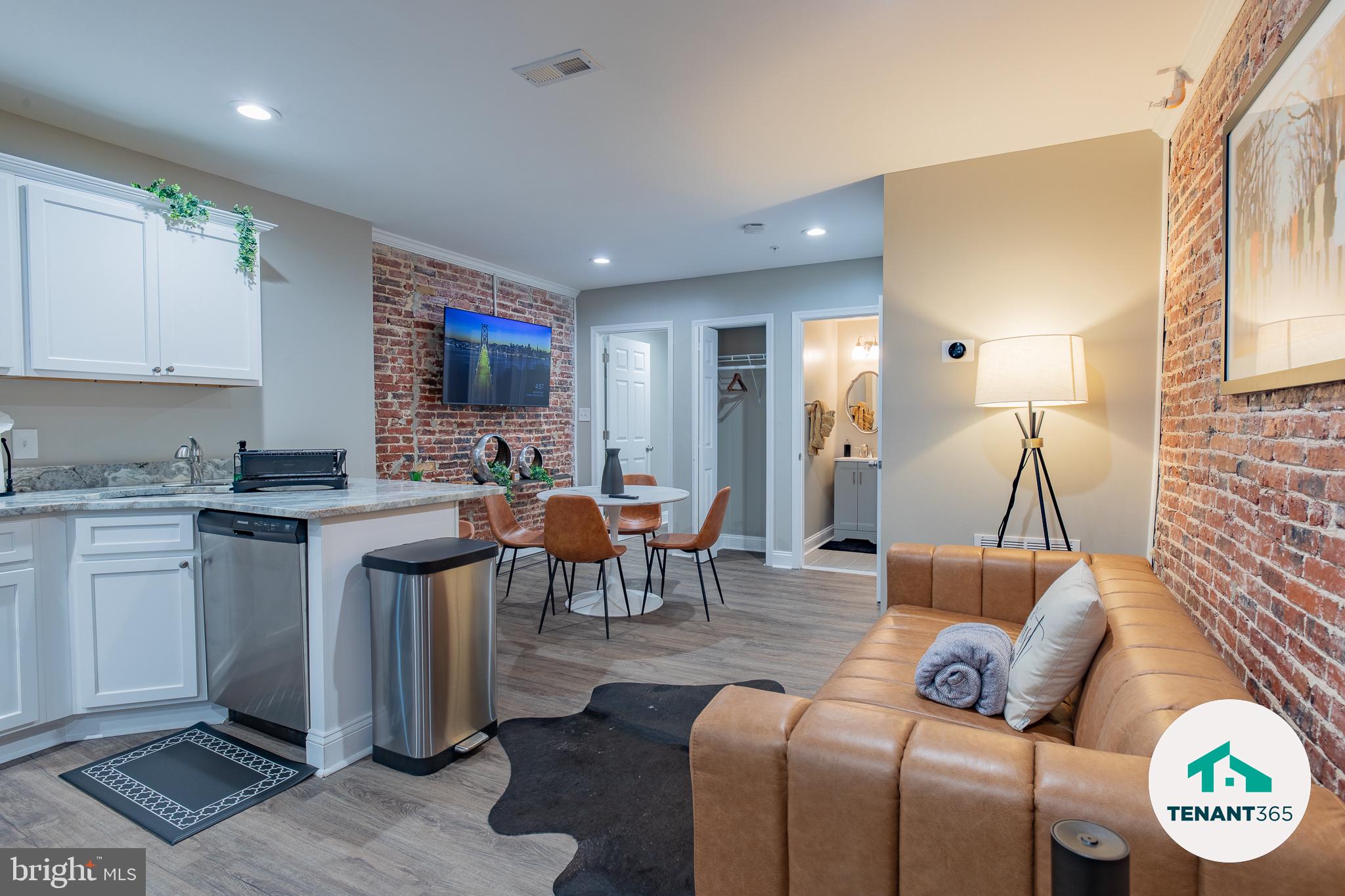 3221 Noble Street, Unit 4 Baltimore, MD 21224 - Photo 3 of 18 Chic urban living with exposed brick.