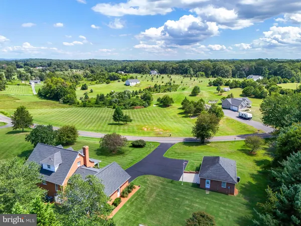 a view of entryway with wooden floor and stairs