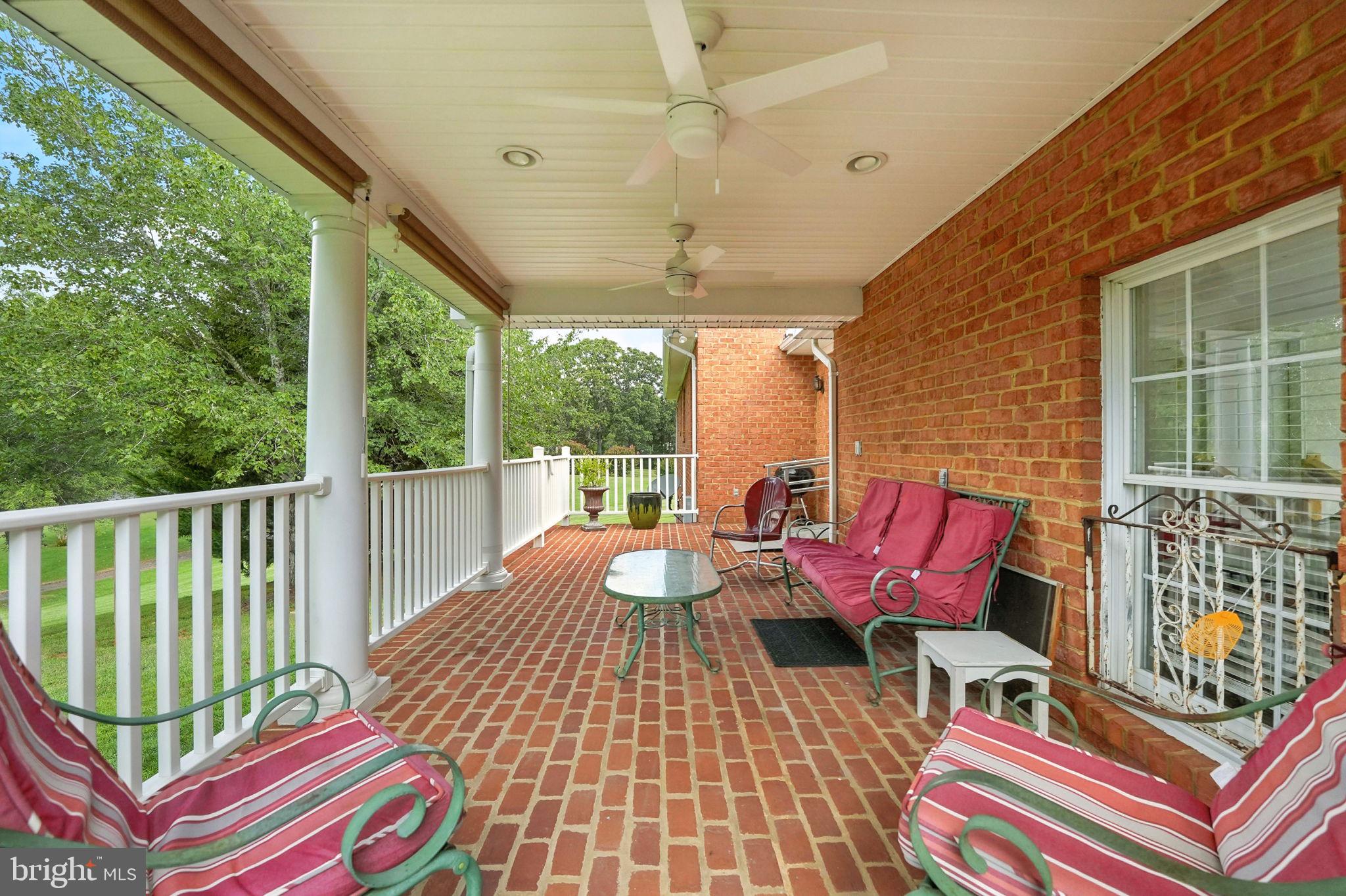 12564 Eggbornsville Road Culpeper, VA 22701 - Photo 16 of 62 a balcony with chairs and wooden floor