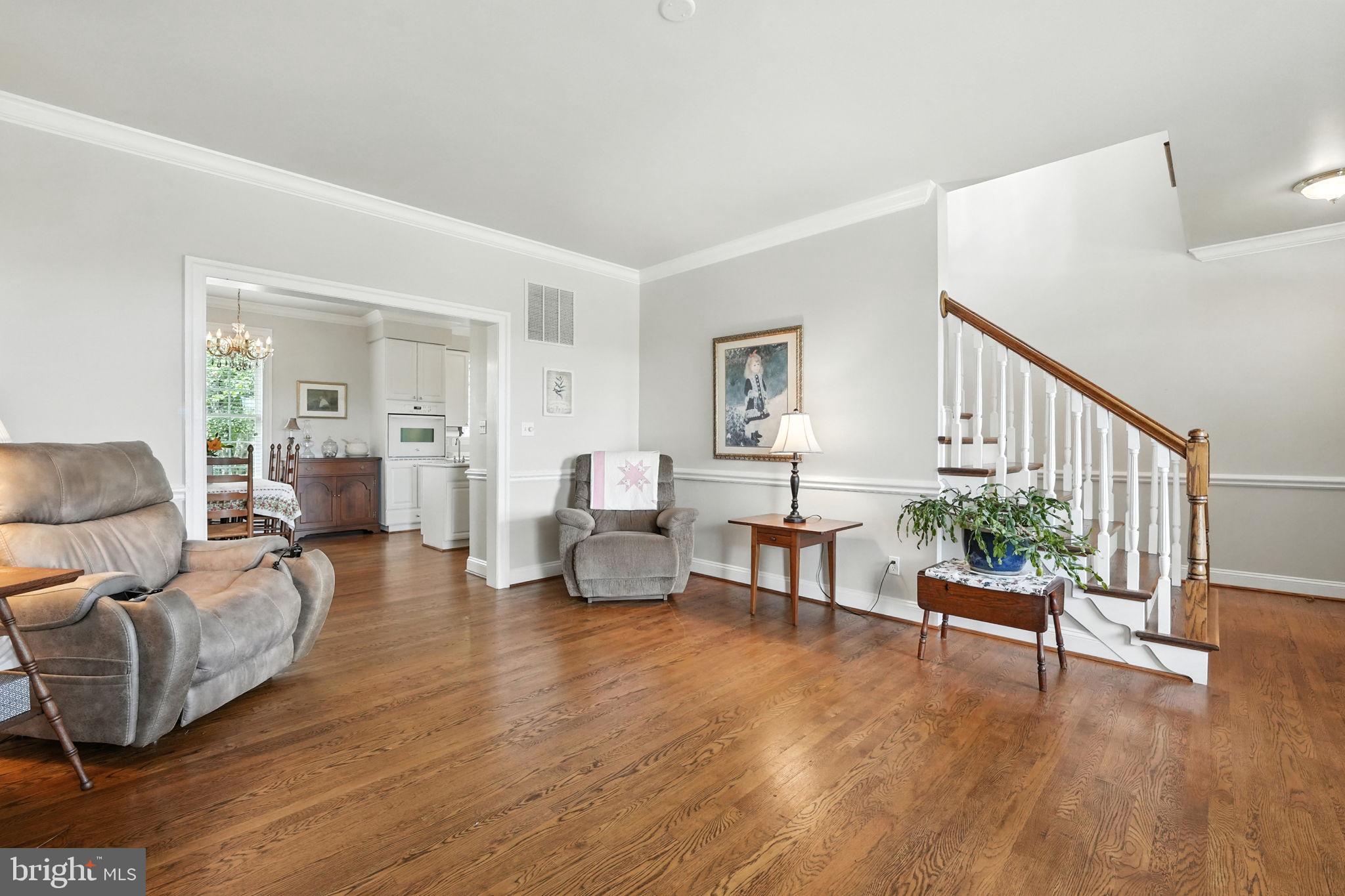 12564 Eggbornsville Road Culpeper, VA 22701 - Photo 20 of 62 a living room with furniture and a wooden floor