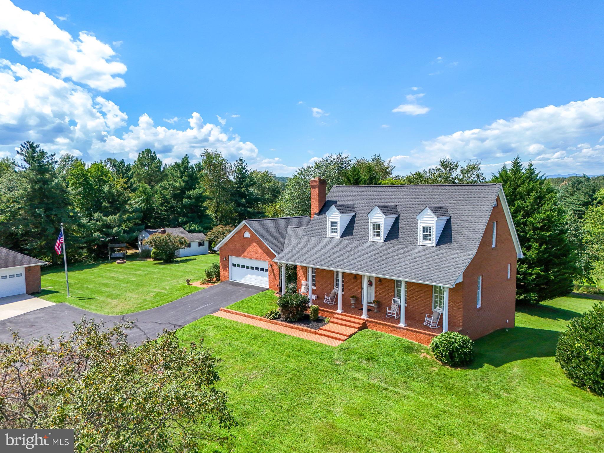 12564 Eggbornsville Road Culpeper, VA 22701 - Photo 2 of 62 a view of a house with a big yard potted plants and large tree