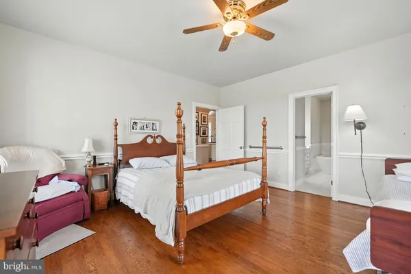 a view of bedroom with wooden floor