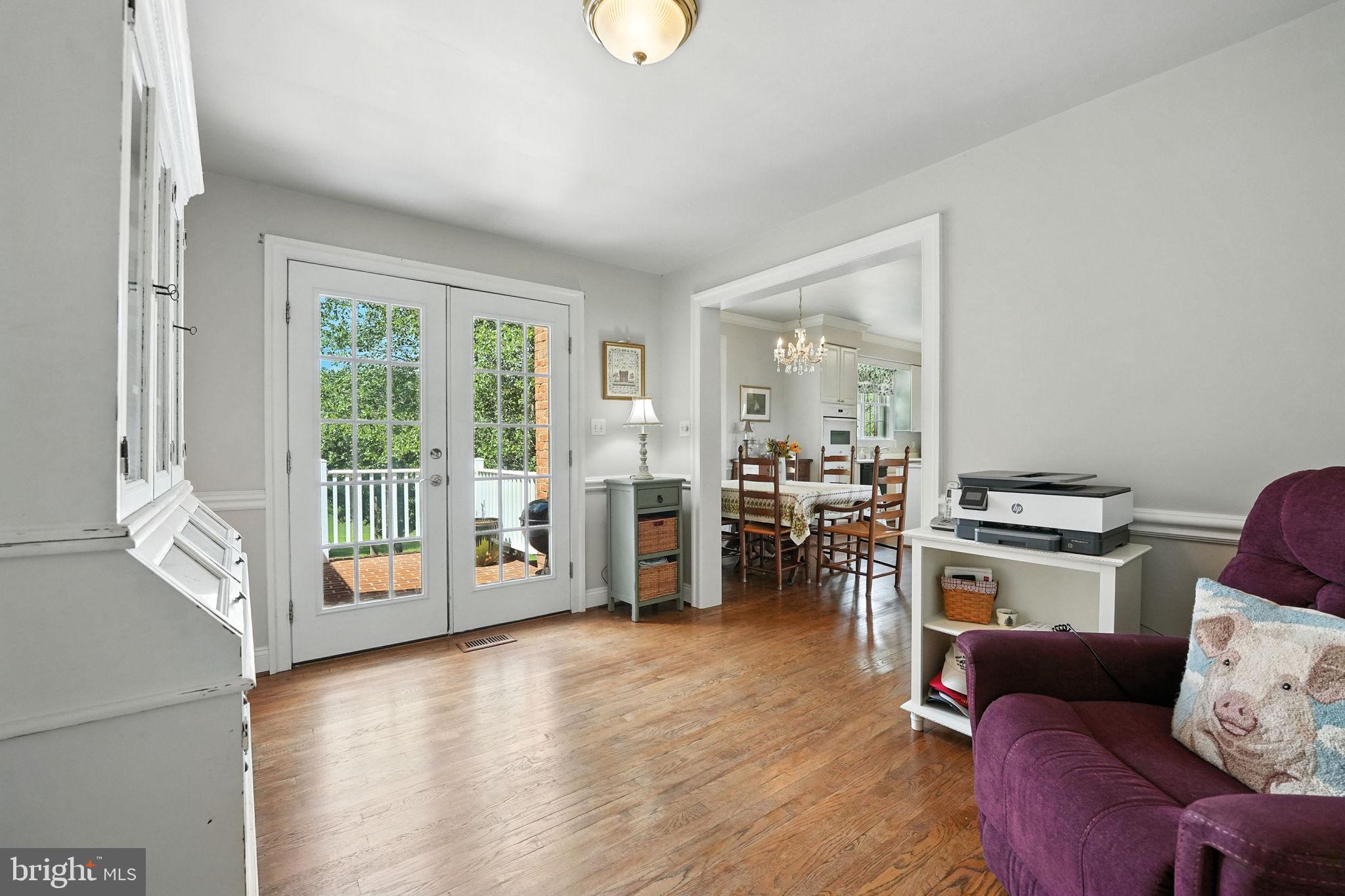 12564 Eggbornsville Road Culpeper, VA 22701 - Photo 36 of 62 a living room with furniture and wooden floor