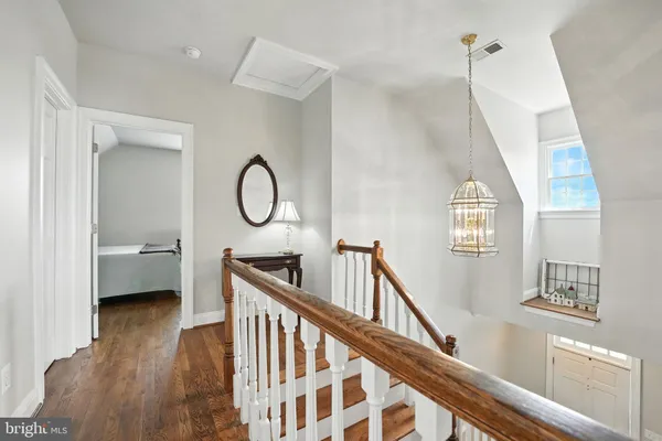 a kitchen with stainless steel appliances granite countertop a sink stove refrigerator and cabinets