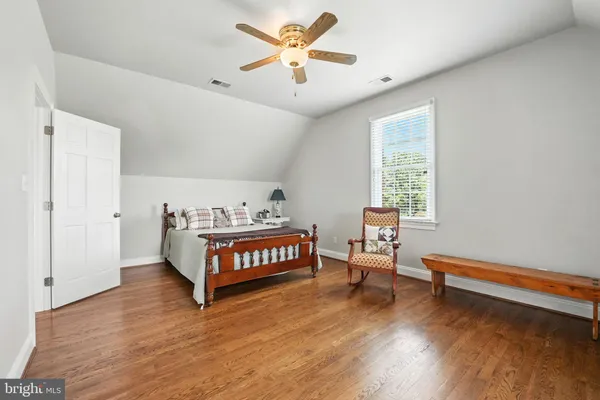 a view of a dining room with furniture and a chandelier