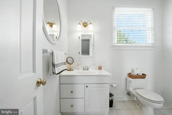 a view of a livingroom with furniture and a window