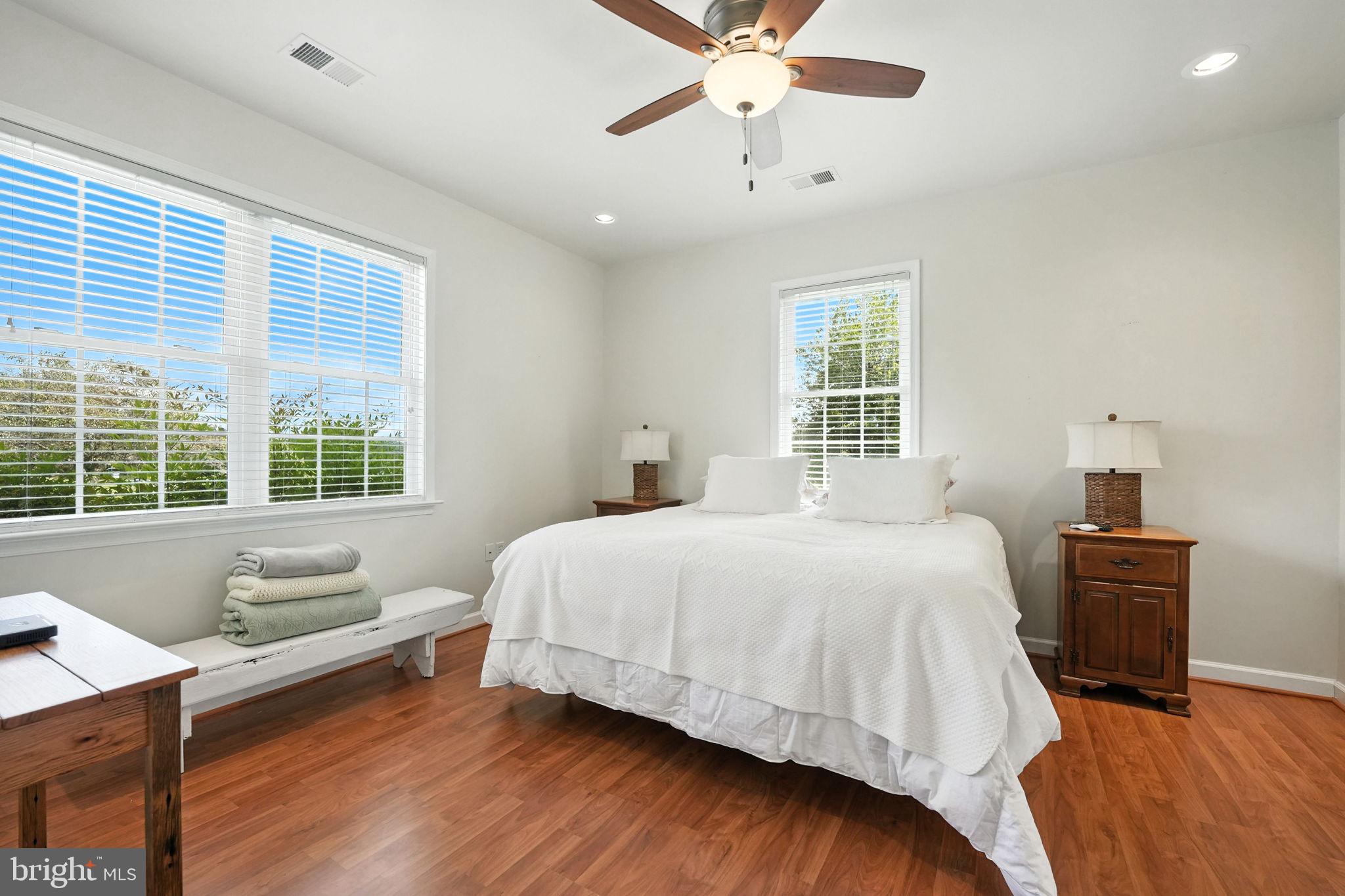 12564 Eggbornsville Road Culpeper, VA 22701 - Photo 47 of 62 a bedroom with a bed and wooden floor