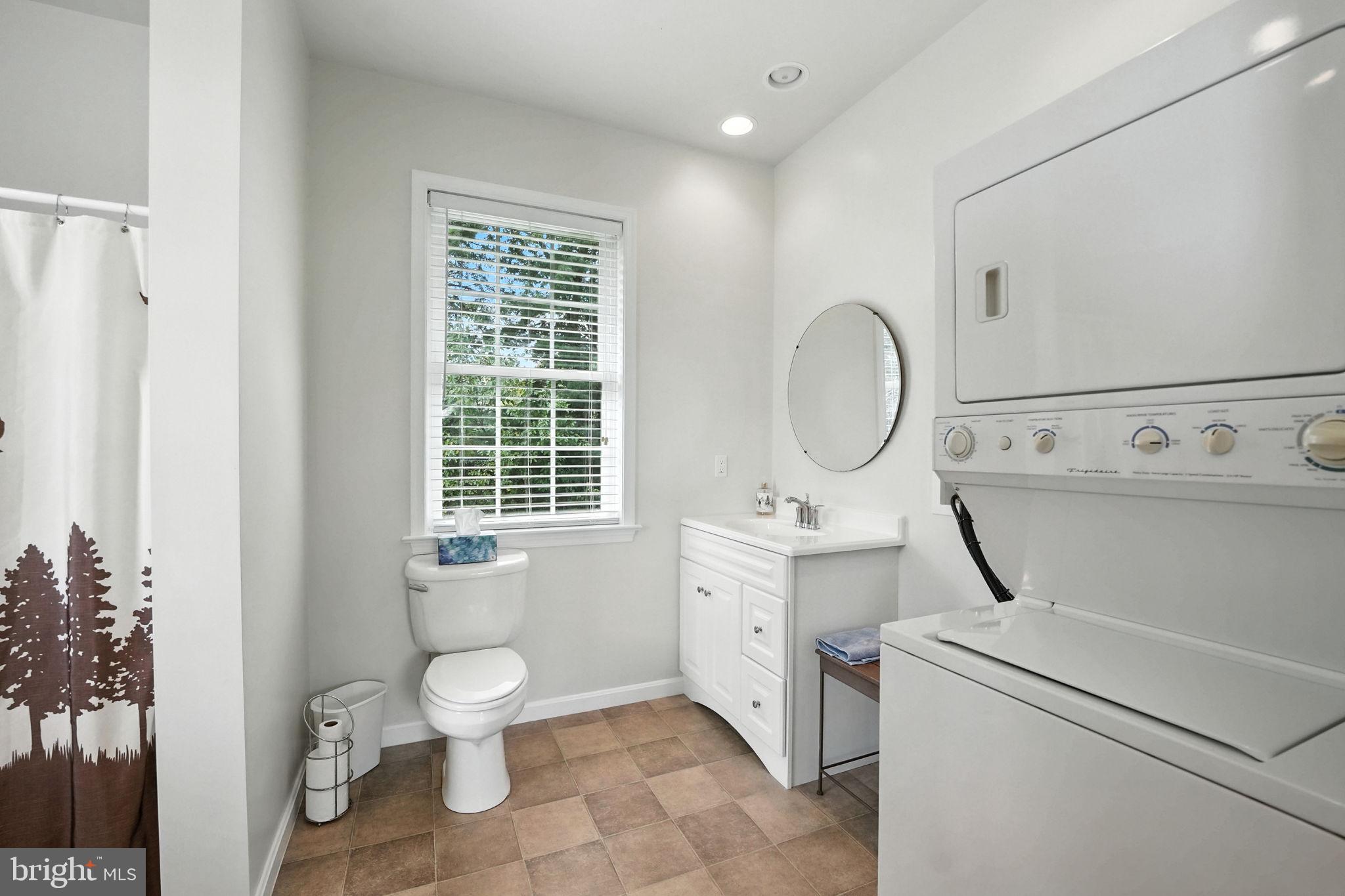 12564 Eggbornsville Road Culpeper, VA 22701 - Photo 52 of 62 a bathroom with a toilet sink vanity granite and a shower