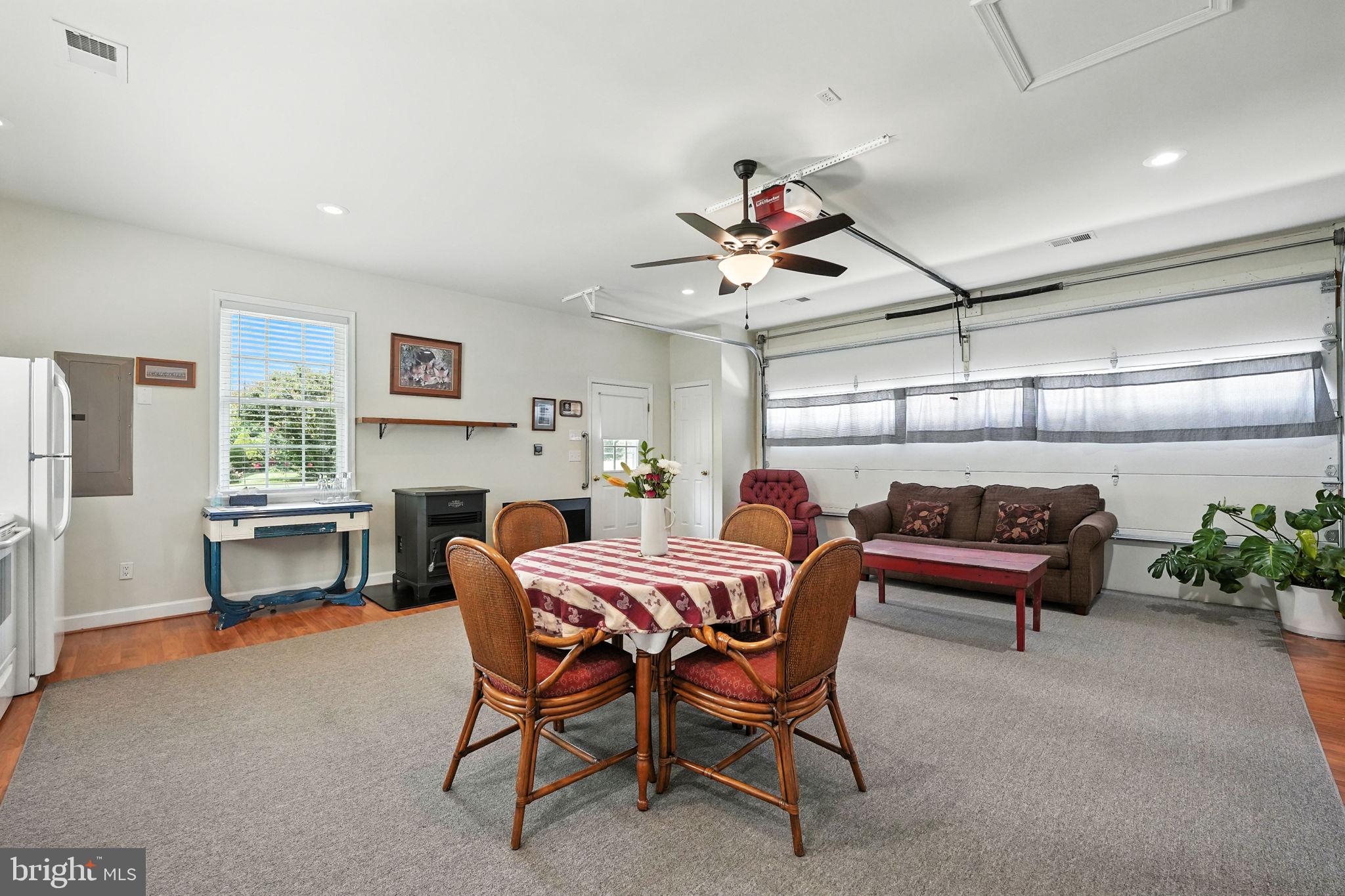 12564 Eggbornsville Road Culpeper, VA 22701 - Photo 54 of 62 a view of a dining room with furniture and a chandelier