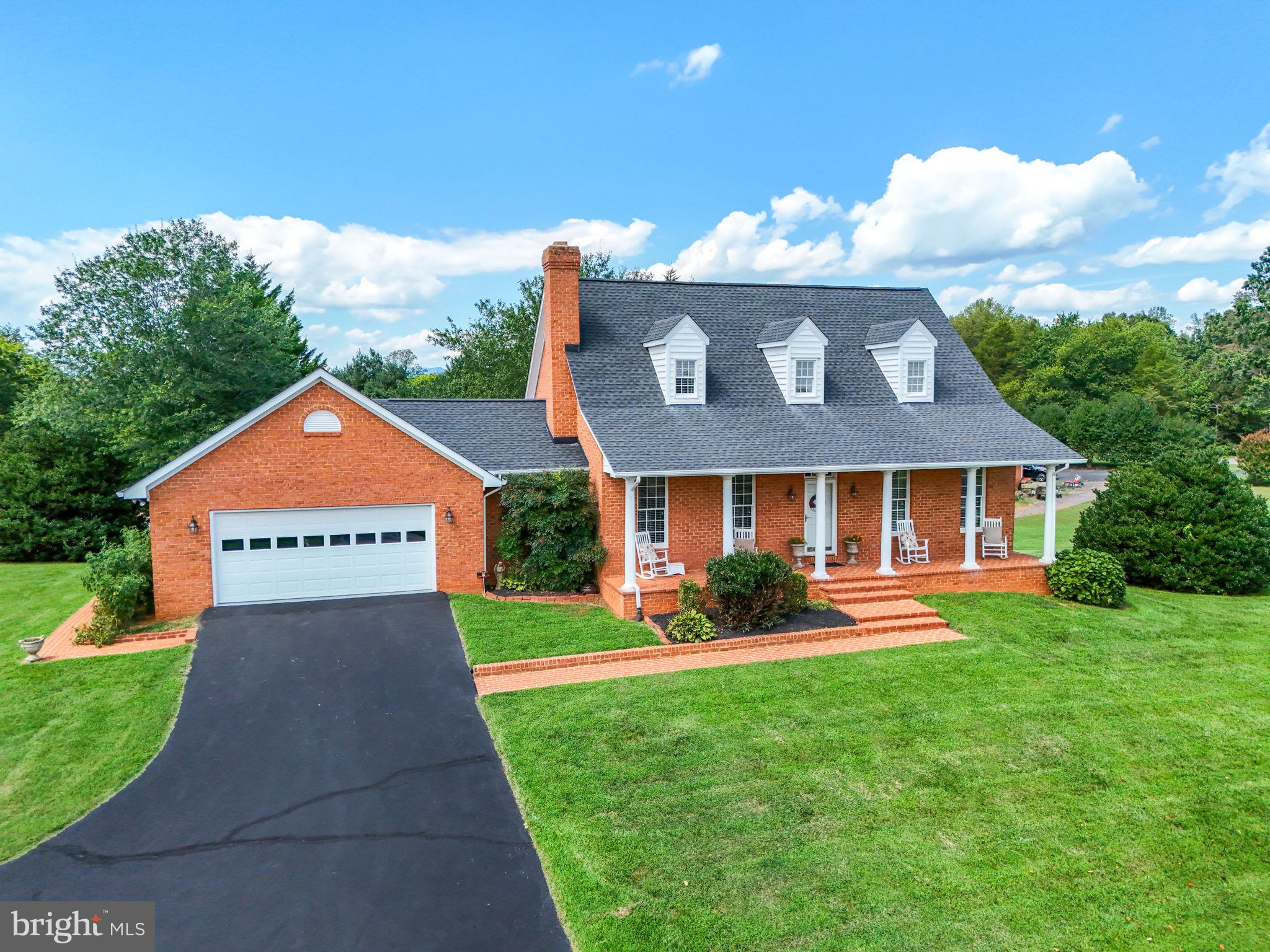 12564 Eggbornsville Road Culpeper, VA 22701 - Photo 6 of 62 a front view of a house with a yard and garage