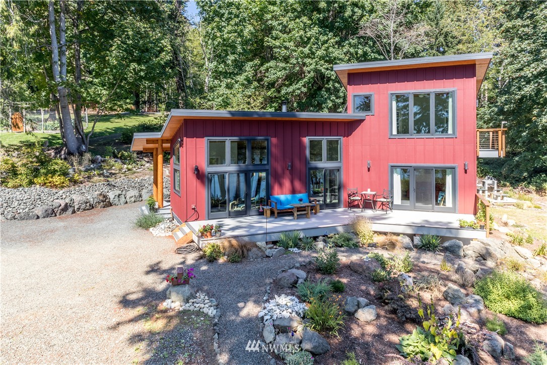 884 McDonald Road, Unit EXT Quilcene, WA 98376 - Photo 2 of 38 a view of house with yard outdoor seating and barbeque oven