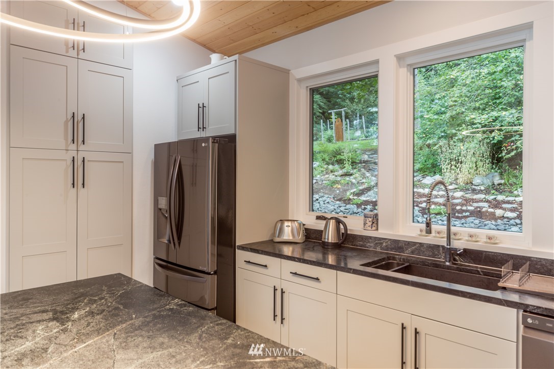 884 McDonald Road, Unit EXT Quilcene, WA 98376 - Photo 12 of 38 a kitchen with a refrigerator and a sink