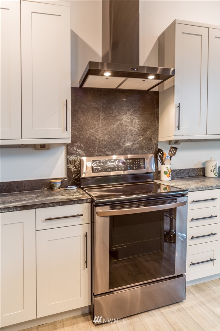 884 McDonald Road, Unit EXT Quilcene, WA 98376 - Photo 13 of 38 a stove top oven sitting inside of a kitchen