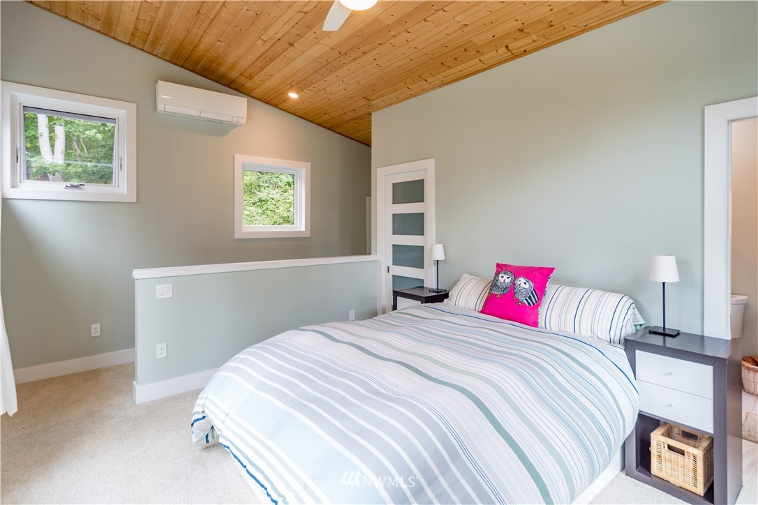 884 McDonald Road, Unit EXT Quilcene, WA 98376 - Photo 22 of 38 a bedroom with a bed and a window
