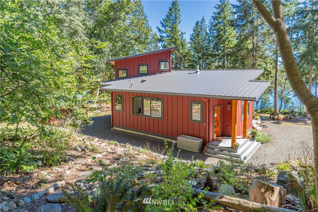 884 McDonald Road, Unit EXT Quilcene, WA 98376 - Photo 27 of 38 front view of a house with a yard