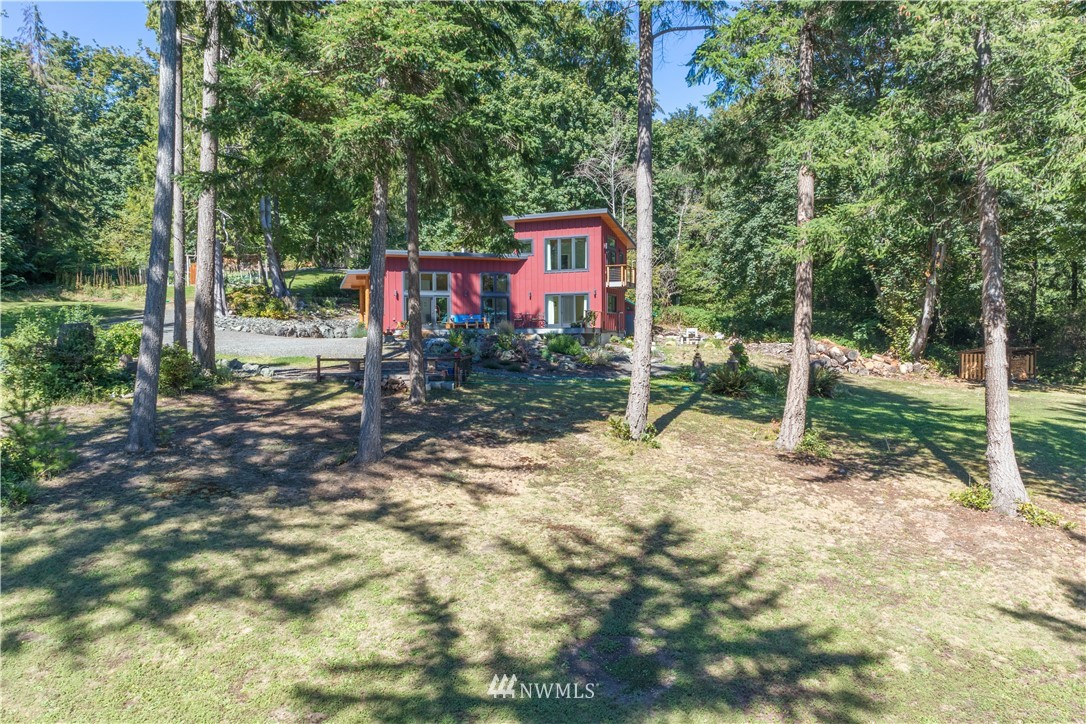 884 McDonald Road, Unit EXT Quilcene, WA 98376 - Photo 28 of 38 a view of a house with backyard and trees