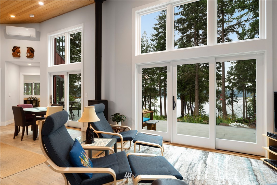 884 McDonald Road, Unit EXT Quilcene, WA 98376 - Photo 7 of 38 a living room with furniture and large windows