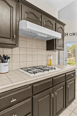 a kitchen with a sink and cabinets