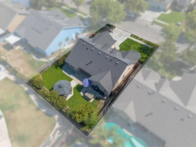 an aerial view of a highlighted house