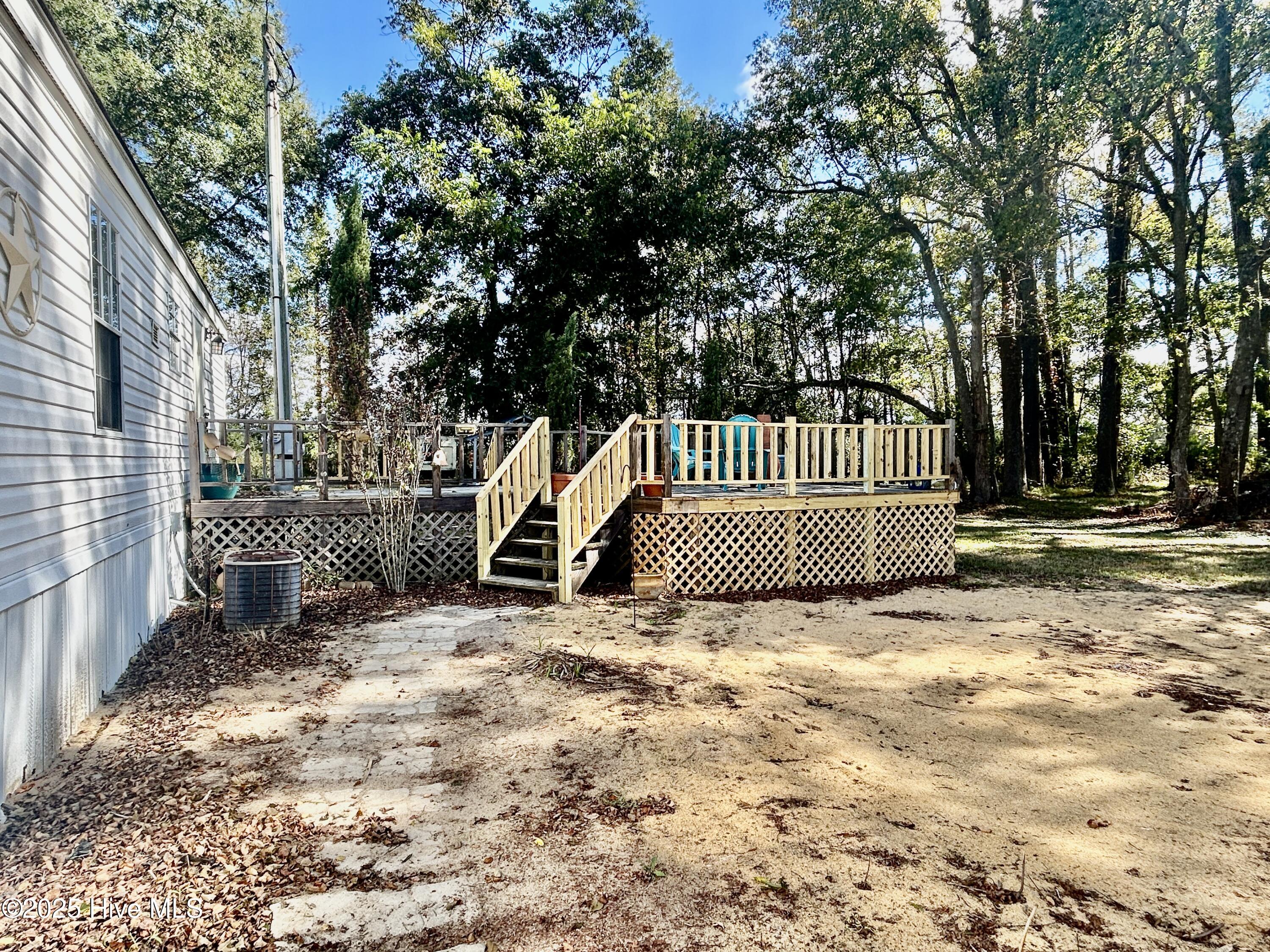 101 Dudley Farm Road Scotland Neck, NC 27874 - Photo 39 of 45 view of back deck from right/back side of home