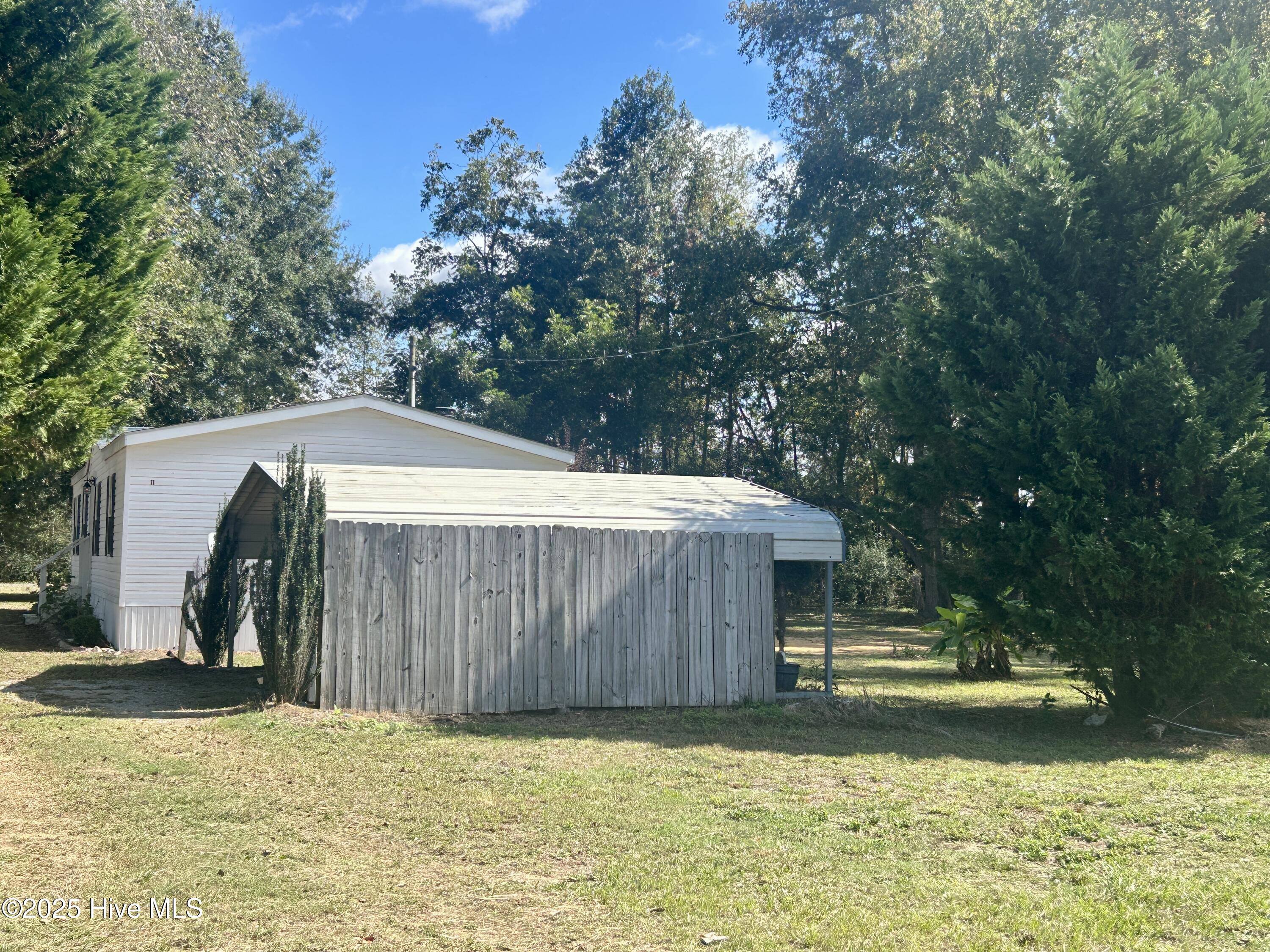 101 Dudley Farm Road Scotland Neck, NC 27874 - Photo 43 of 45 view of the home and carport (behind the short fence)