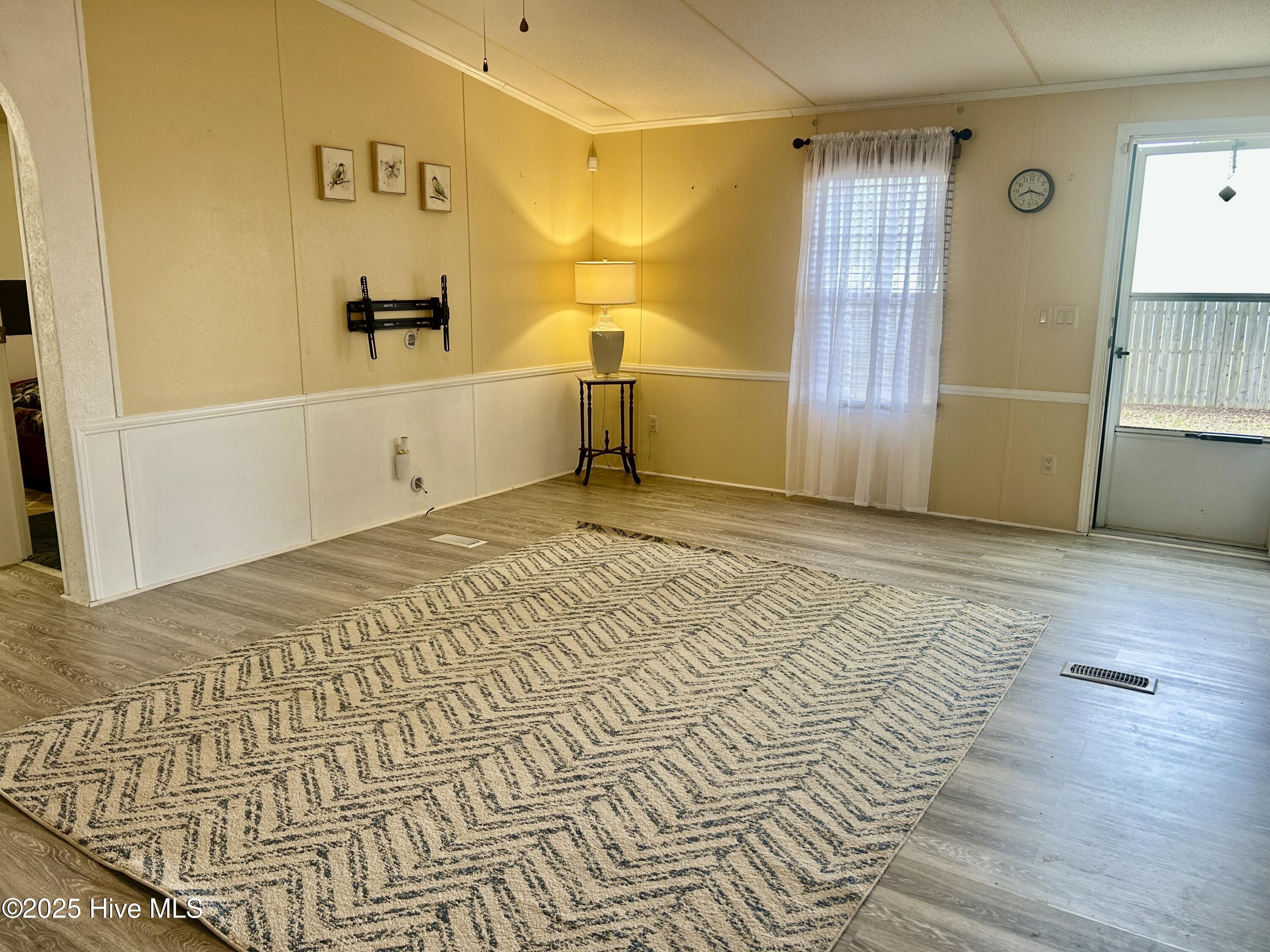 101 Dudley Farm Road Scotland Neck, NC 27874 - Photo 8 of 45 living room looking from fireplace to front door