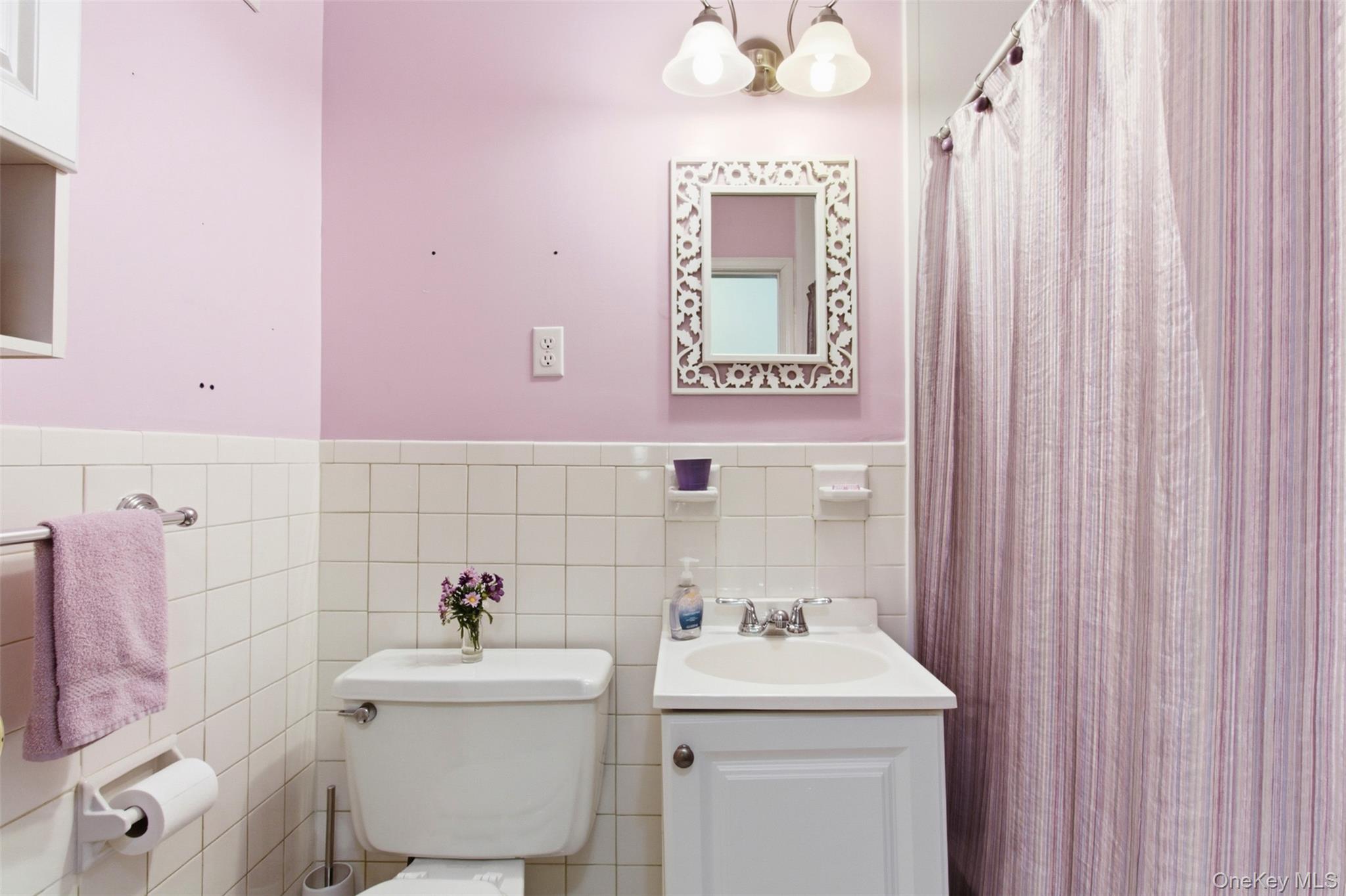 100 Gateway Road, Unit 192N Yonkers, NY 10703 - Photo 16 of 16 a bathroom with a sink a toilet and mirror