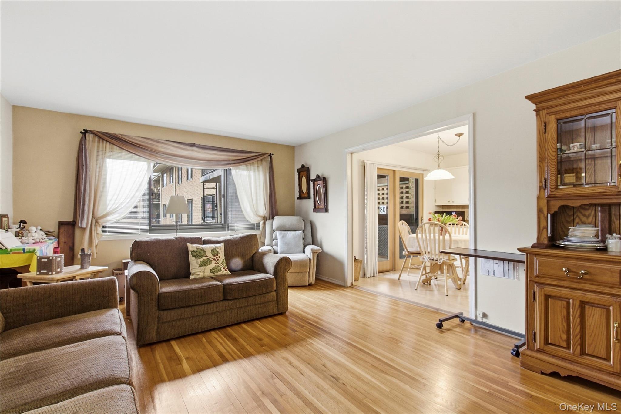 100 Gateway Road, Unit 192N Yonkers, NY 10703 - Photo 5 of 16 a living room with furniture and a fireplace