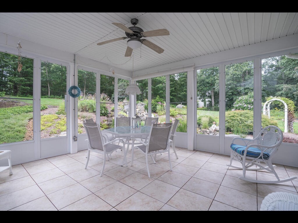 20 Paradise Lake Road Monson, MA 01057 - Photo 12 of 42 a living room with furniture and large windows