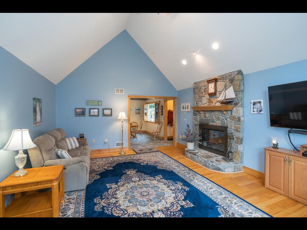 20 Paradise Lake Road Monson, MA 01057 - Photo 17 of 42 a living room with furniture a flat screen tv and a fireplace