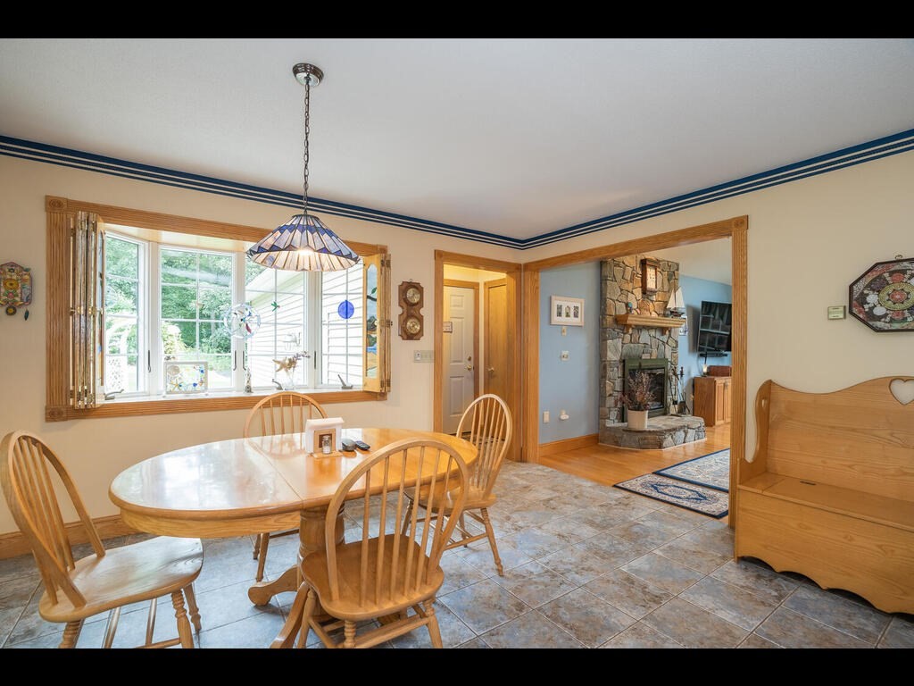 20 Paradise Lake Road Monson, MA 01057 - Photo 19 of 42 a dining room with furniture and a window