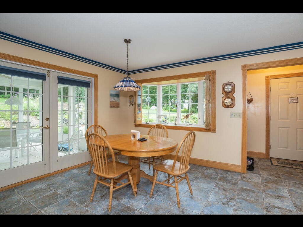20 Paradise Lake Road Monson, MA 01057 - Photo 20 of 42 a dining room with furniture a chandelier and wooden floor
