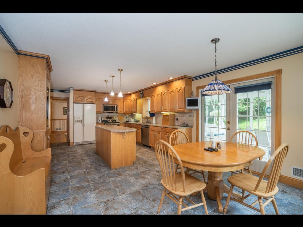 20 Paradise Lake Road Monson, MA 01057 - Photo 21 of 42 a dining room with furniture and a floor to ceiling window