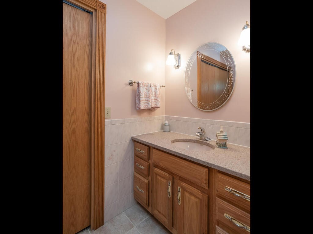 20 Paradise Lake Road Monson, MA 01057 - Photo 26 of 42 a bathroom with a granite countertop sink a mirror and vanity