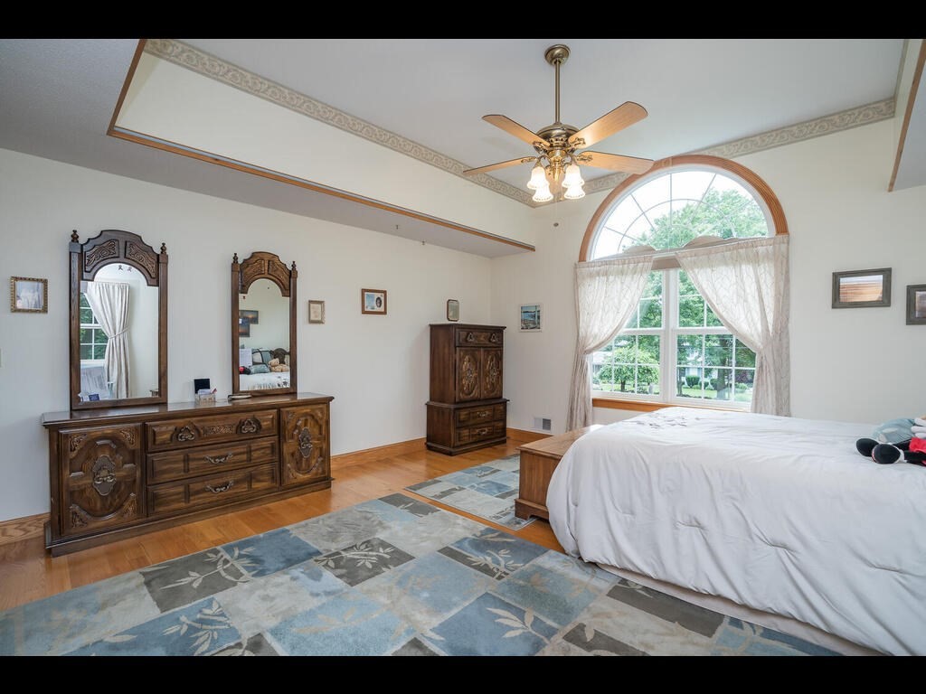 20 Paradise Lake Road Monson, MA 01057 - Photo 30 of 42 a bedroom with a large bed and a large window