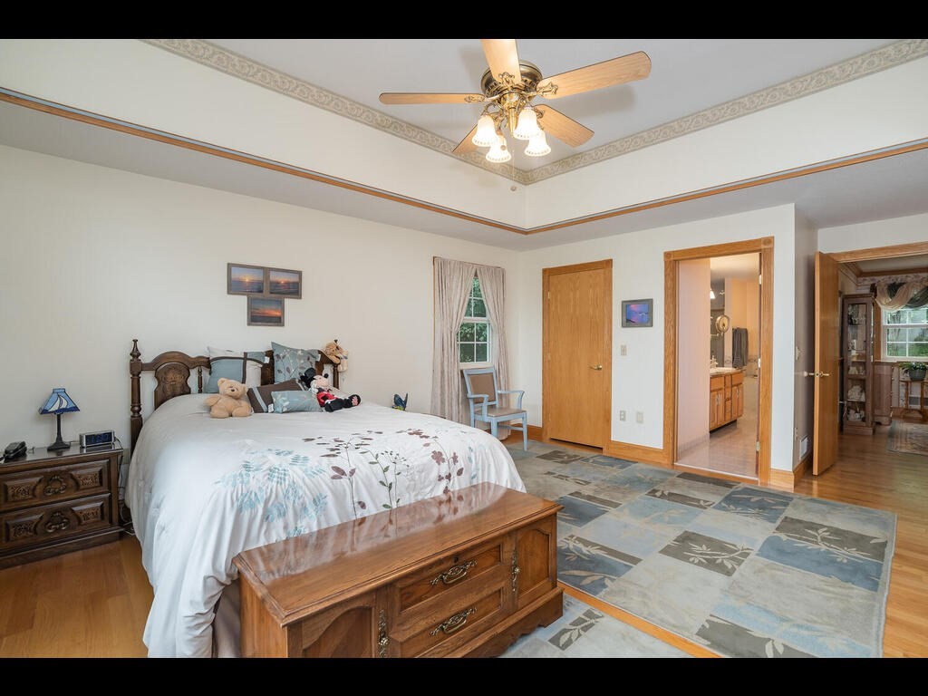 20 Paradise Lake Road Monson, MA 01057 - Photo 31 of 42 a bedroom with a bed a table and painting