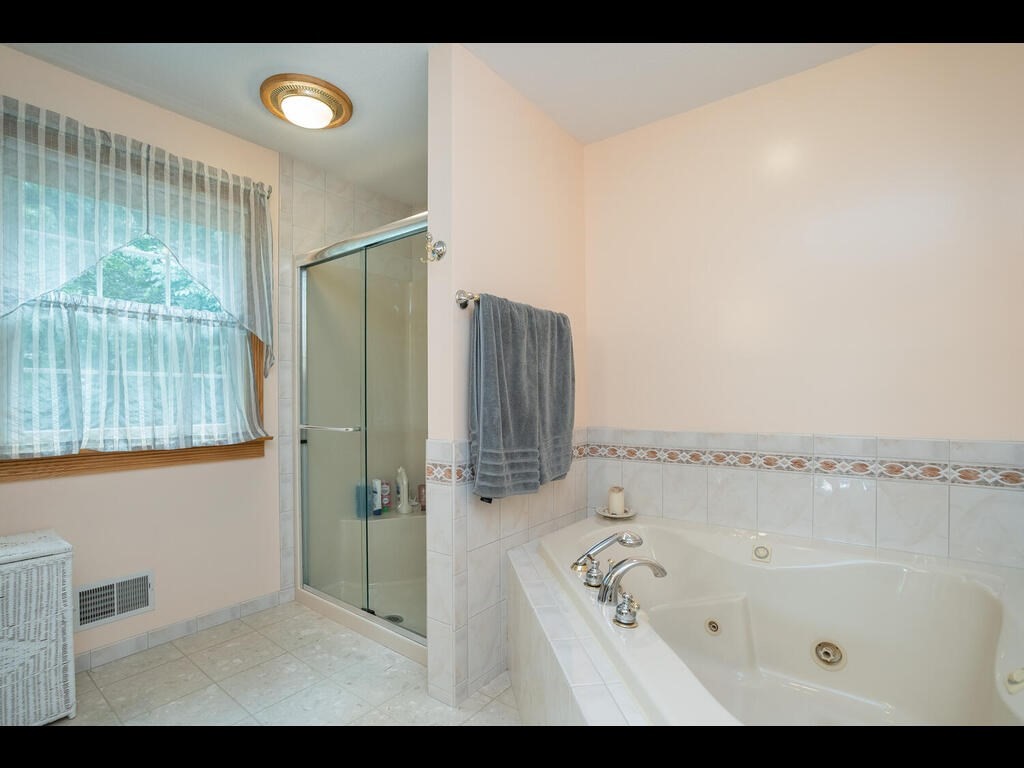 20 Paradise Lake Road Monson, MA 01057 - Photo 33 of 42 a bathroom with a tub and shower