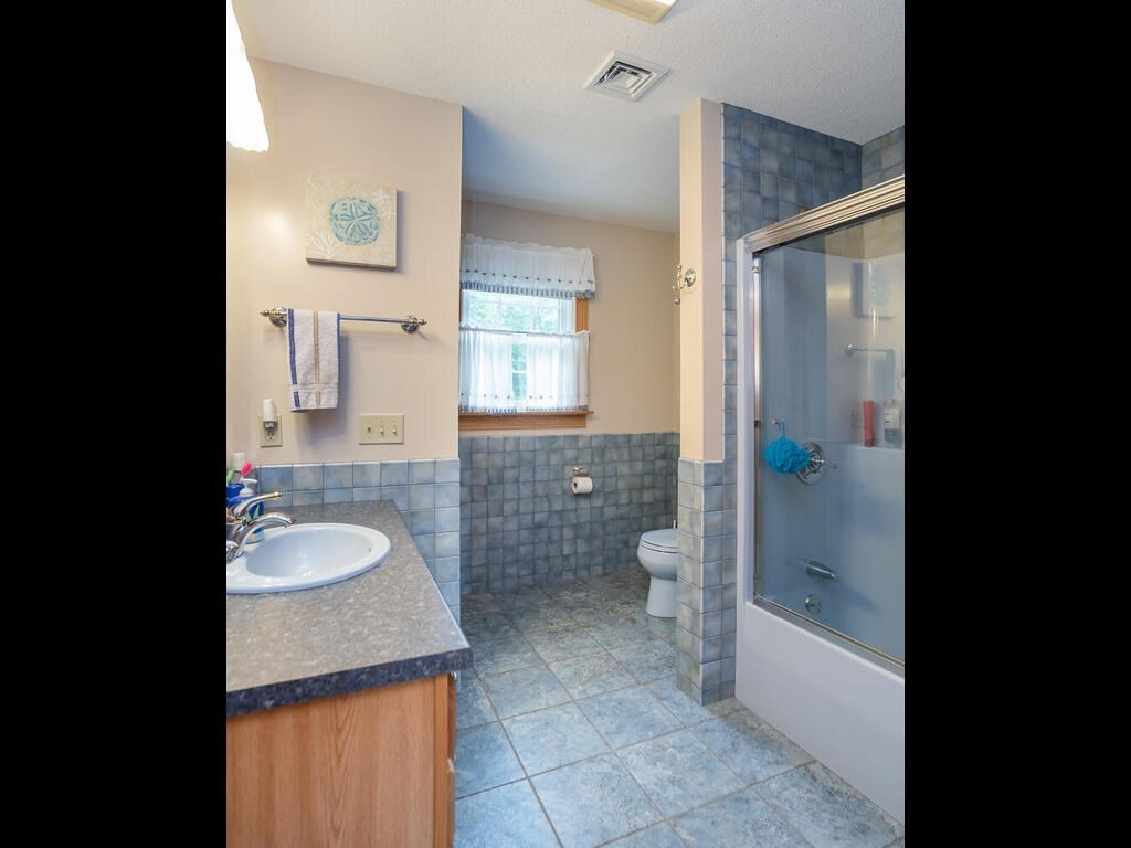 20 Paradise Lake Road Monson, MA 01057 - Photo 36 of 42 a bathroom with a granite countertop sink toilet and shower